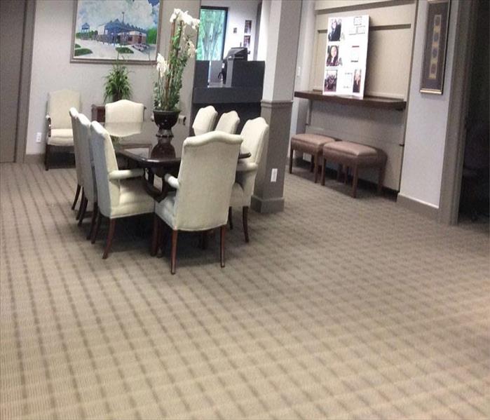 conference table and chairs, dry carpet, professional setting