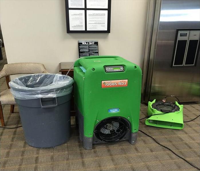 gear drying carpet by a bank vault