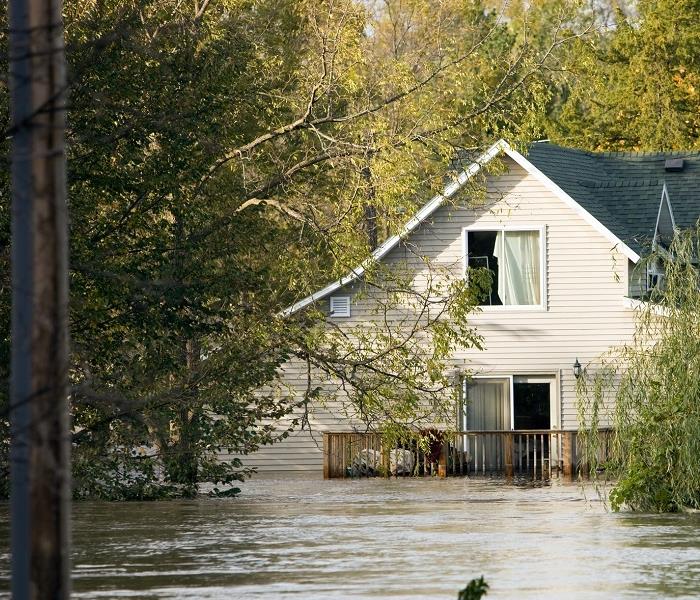 house submerged with floodwater