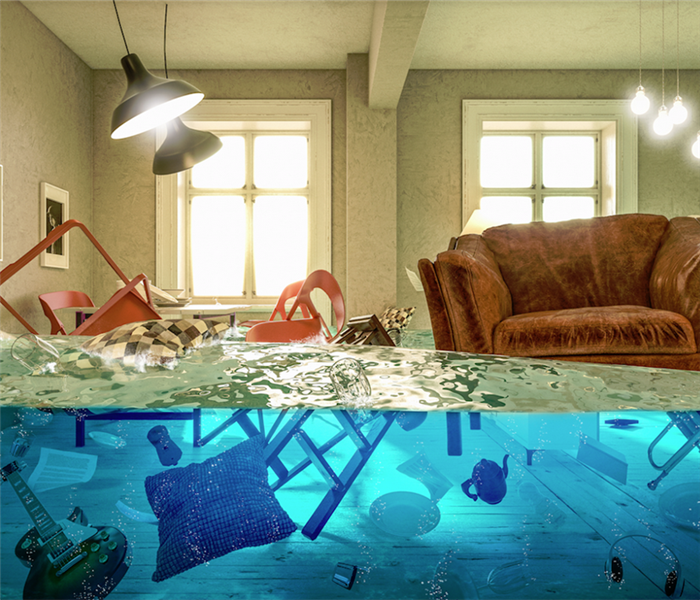 flooded living room with items floating