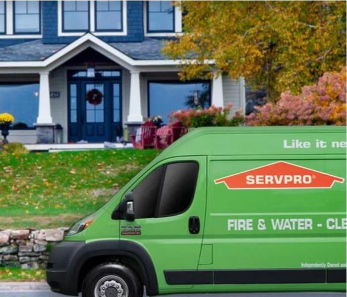 SERVPRO vehicle in front of house