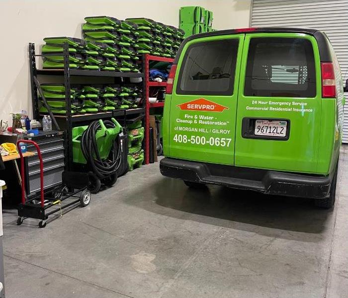 SERVPRO van and water damage equipment in a warehouse