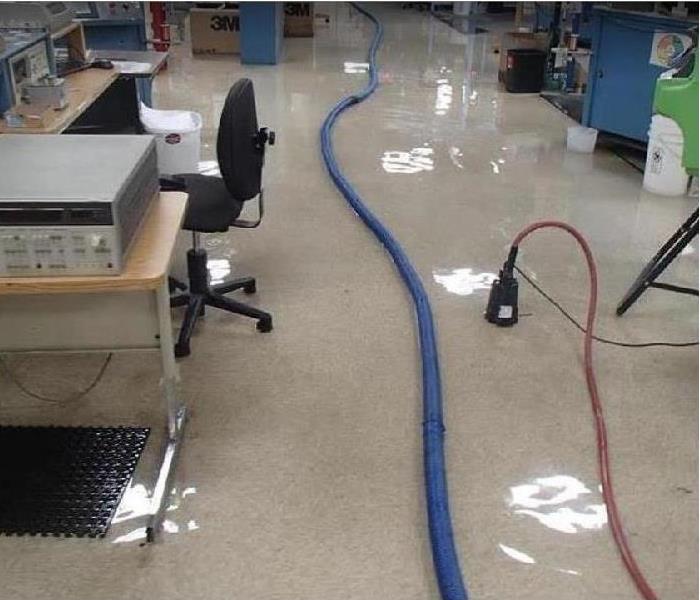 water on office floor; extraction equipment being used